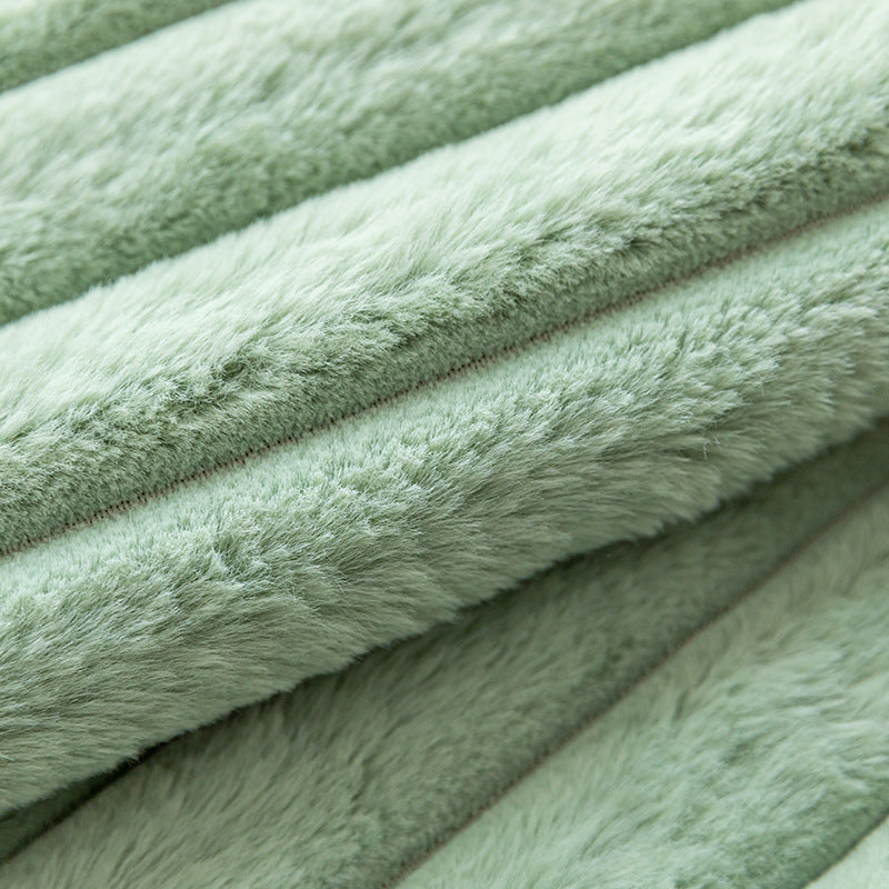Housse de coussin rayée en fausse fourrure