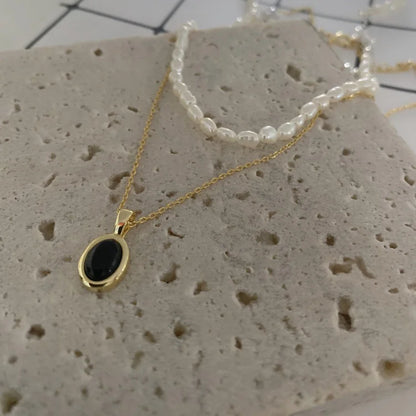 Collier empilable élégant en onyx noir et perles - Collection Aria