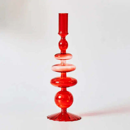 Belle collection de porte-bougies en verre rouges