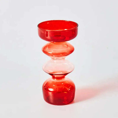 Belle collection de porte-bougies en verre rouges