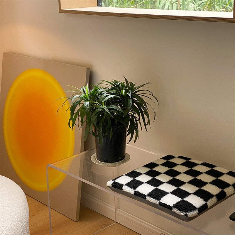 Coussin avec motif de losanges en damier