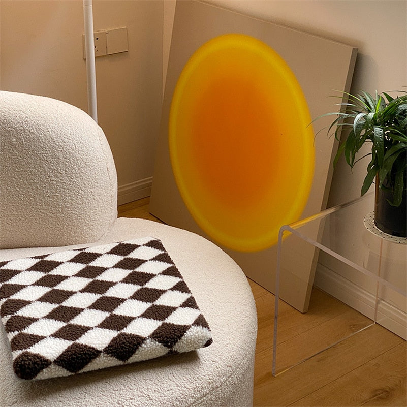 Coussin avec motif de losanges en damier