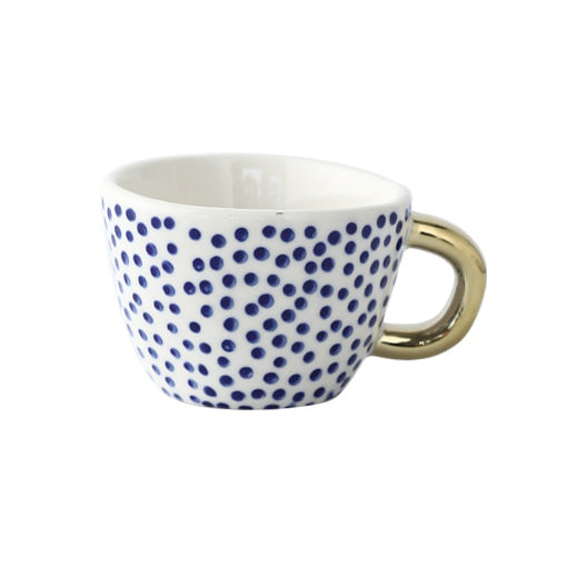 Tasse avec motif géométrique abstrait et anse dorée