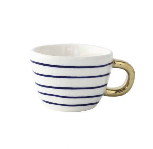 Tasse avec motif géométrique abstrait et anse dorée