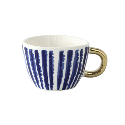 Tasse avec motif géométrique abstrait et anse dorée