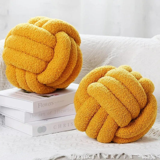 Coussin en forme de balle en peluche décoratif et noué en tissu doux