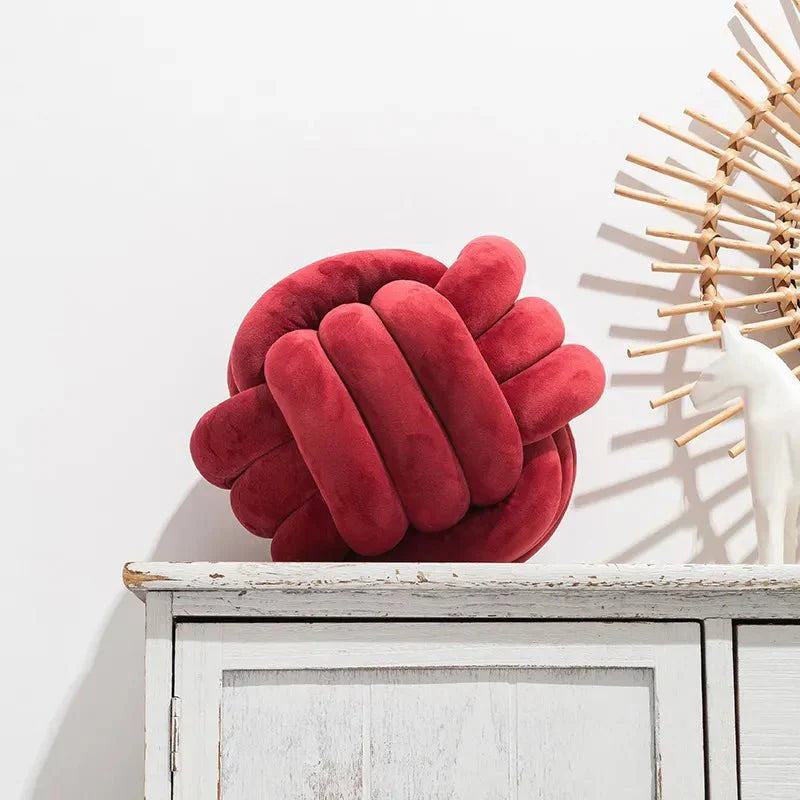 Coussin décoratif et doux avec boule nouée en effet daim