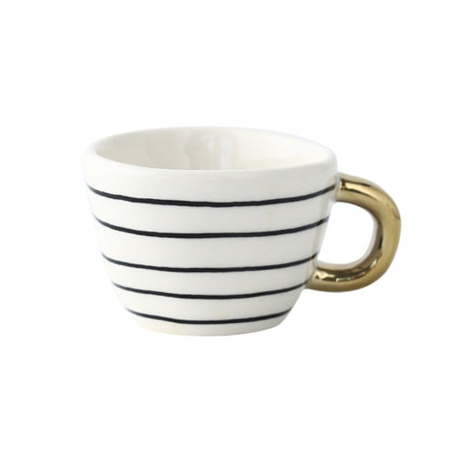 Tasse avec motif géométrique abstrait et anse dorée