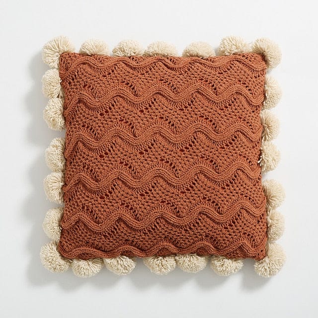 Couvre-coussins en tricot avec pompons