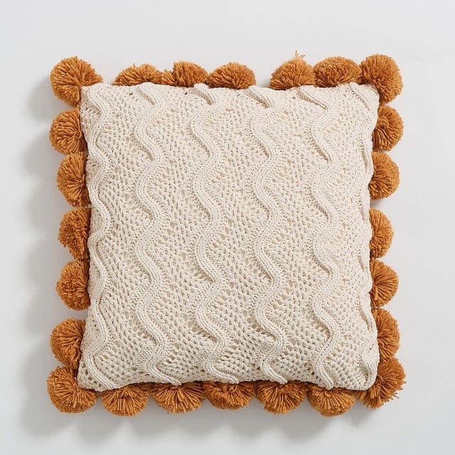 Couvre-coussins en tricot avec pompons